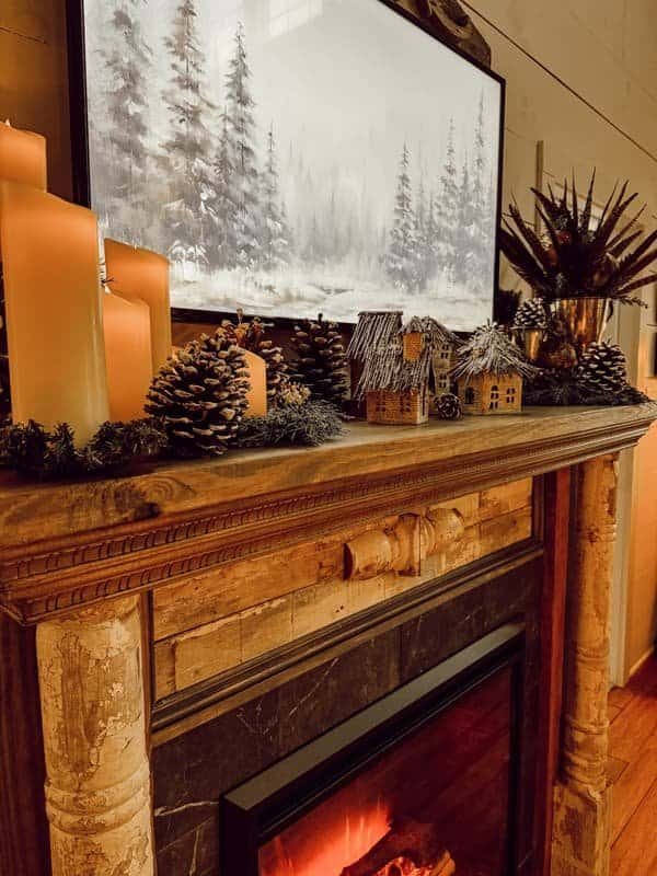 Hygge Scandinavian style winter fireplace mantel with candles