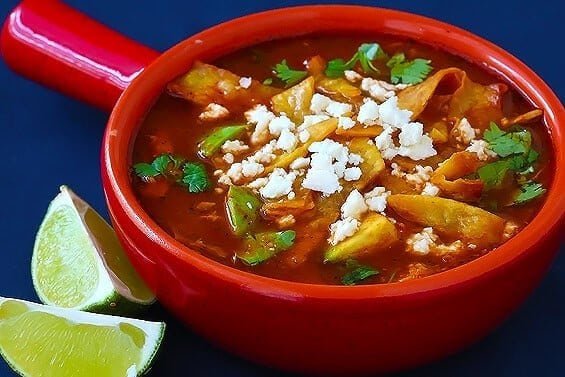 Chicken tortilla soup with avocado and tortilla strips