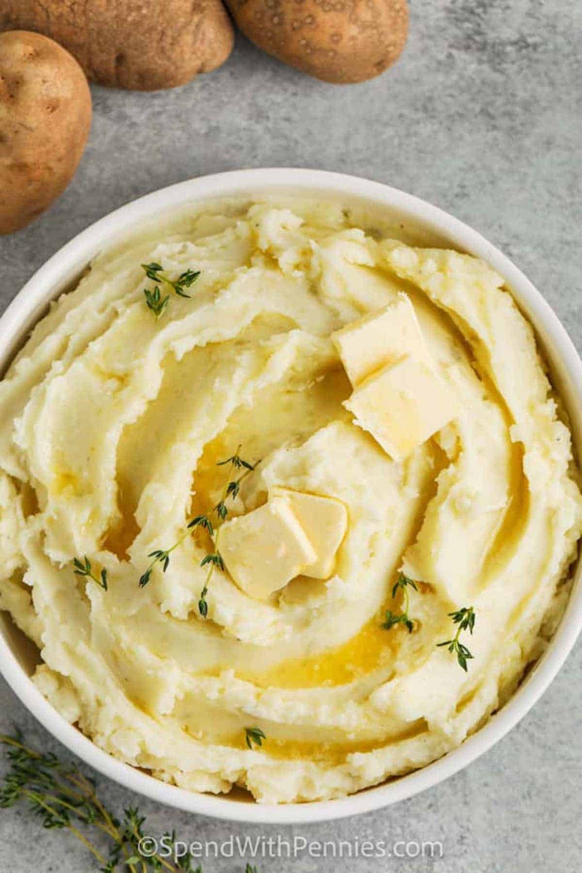 Creamy mashed potatoes with melted butter