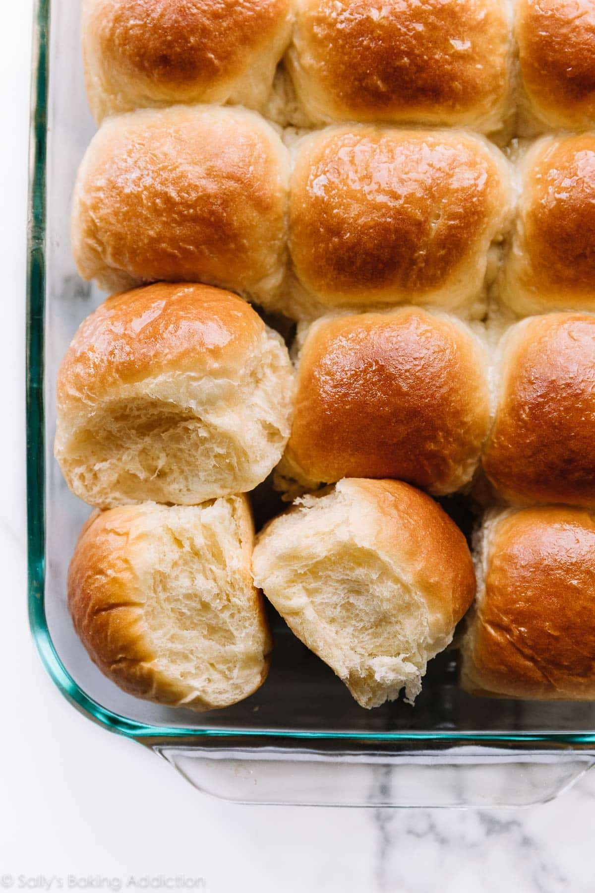 Soft homemade dinner rolls in a pan