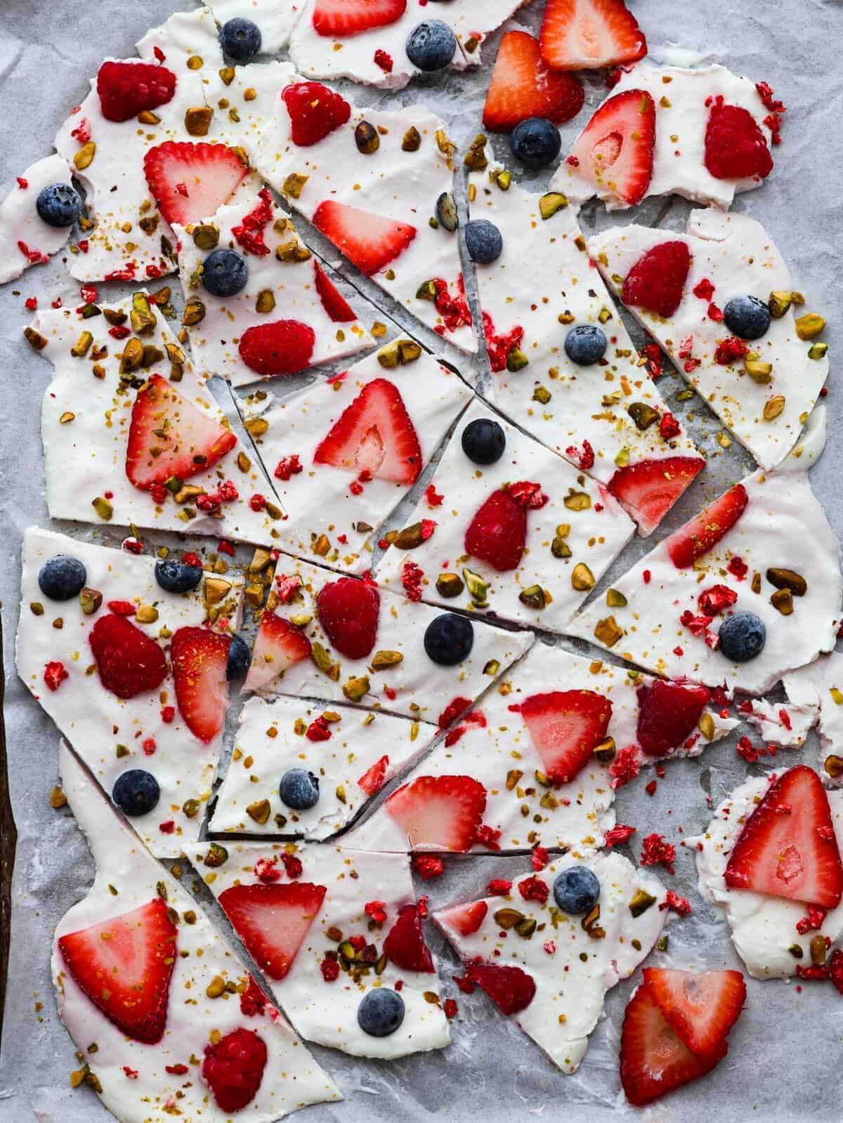 Frozen yogurt bark topped with berries for a healthy after school snack