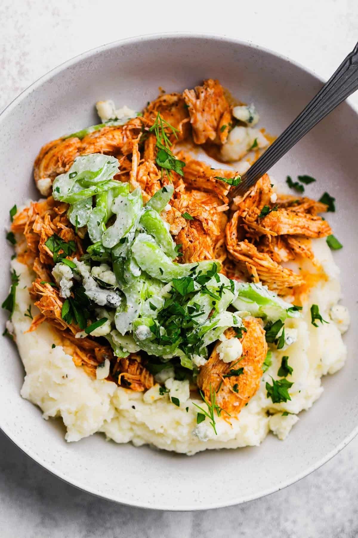 Buffalo chicken mashed potato bowl with celery slaw