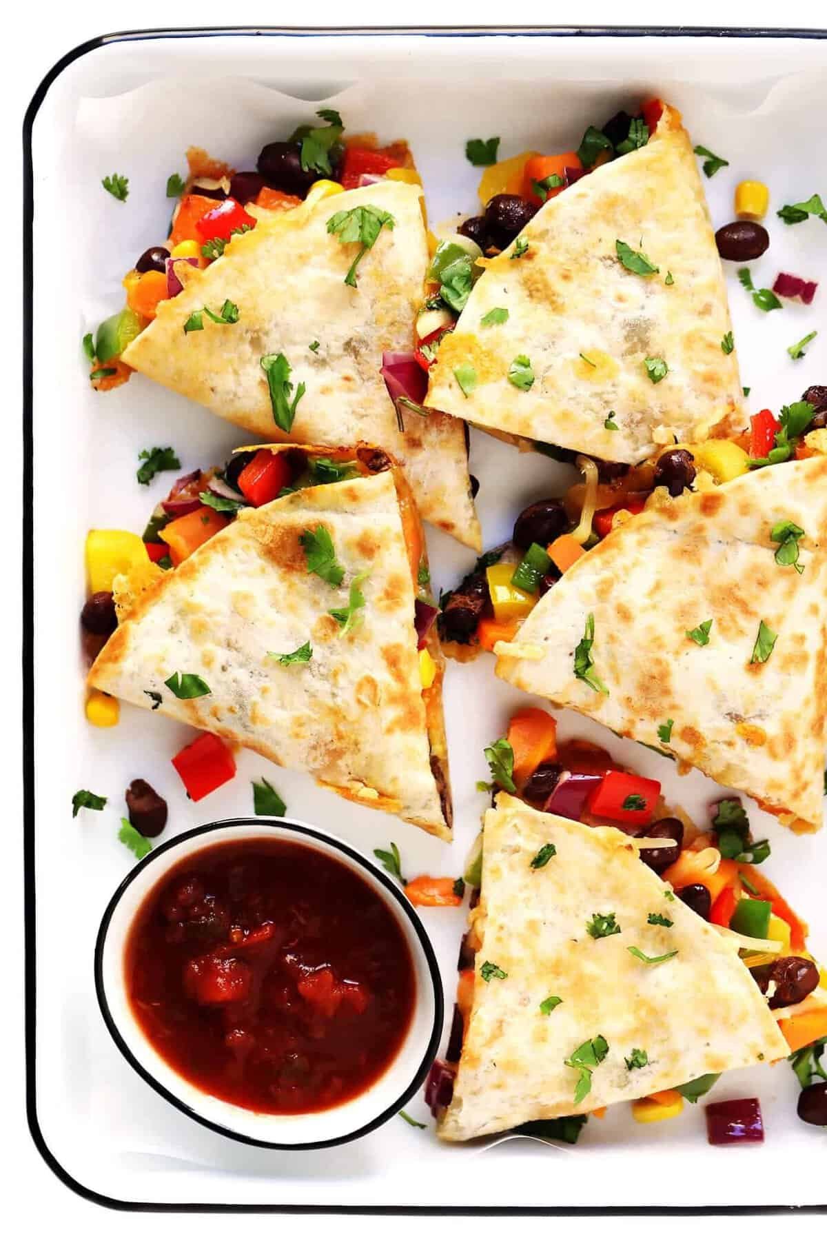 Veggie quesadillas with peppers, corn and black beans on a tray