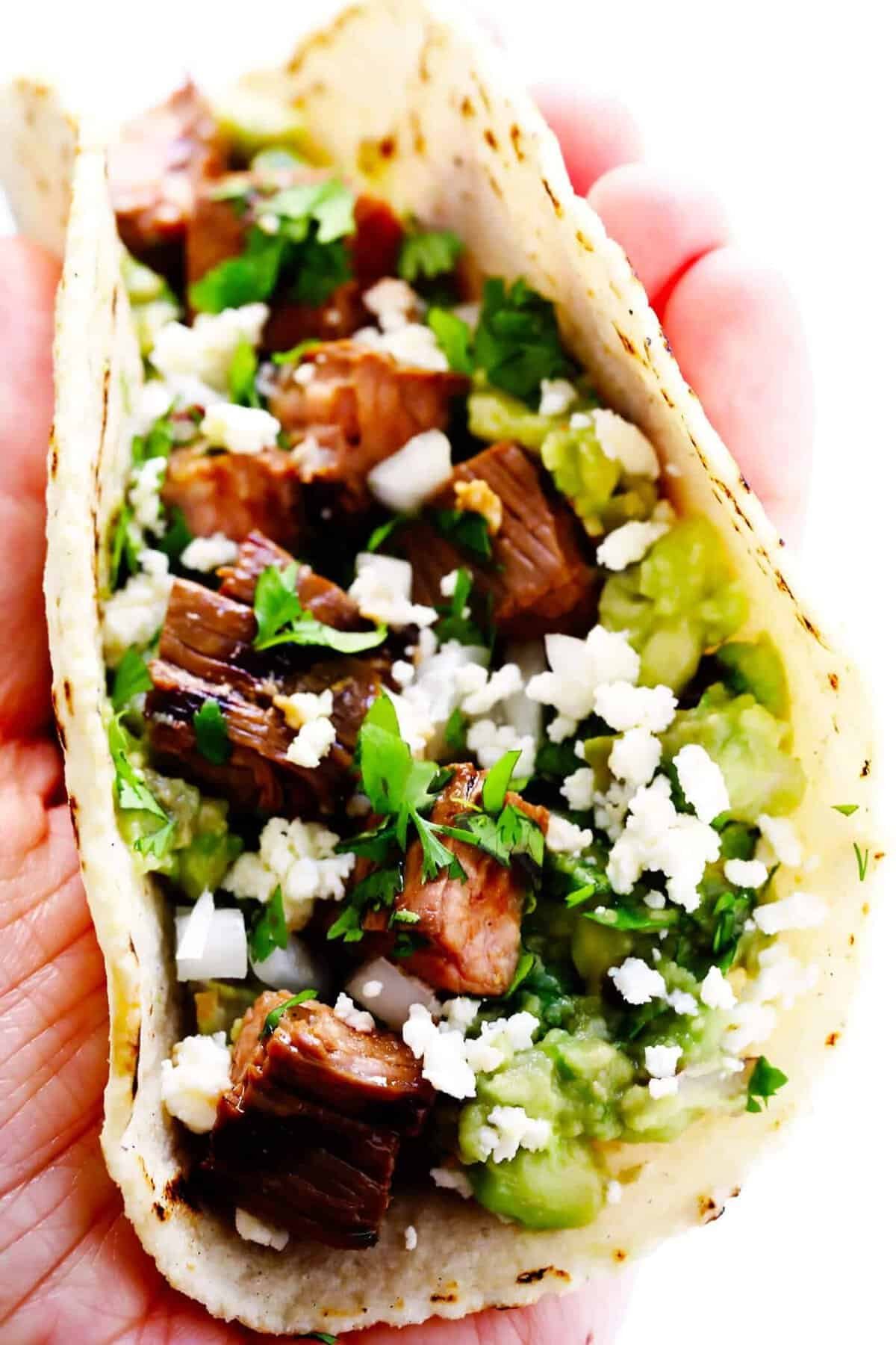 Carne asada street tacos with onion and cilantro