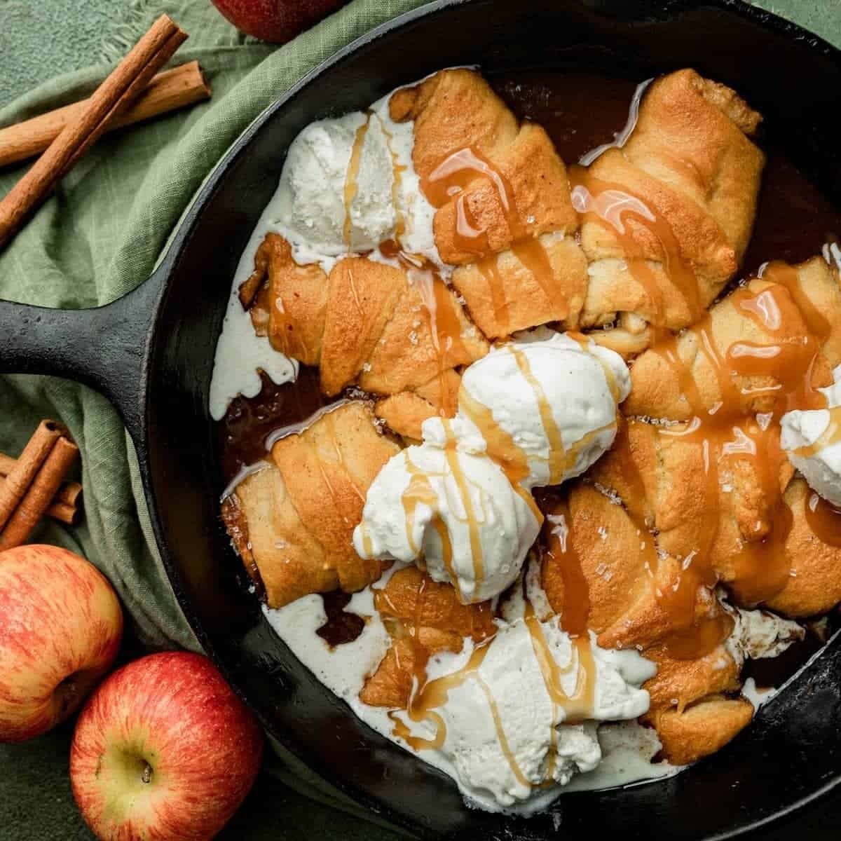 Crescent roll apple dumplings baked in apple cider syrup