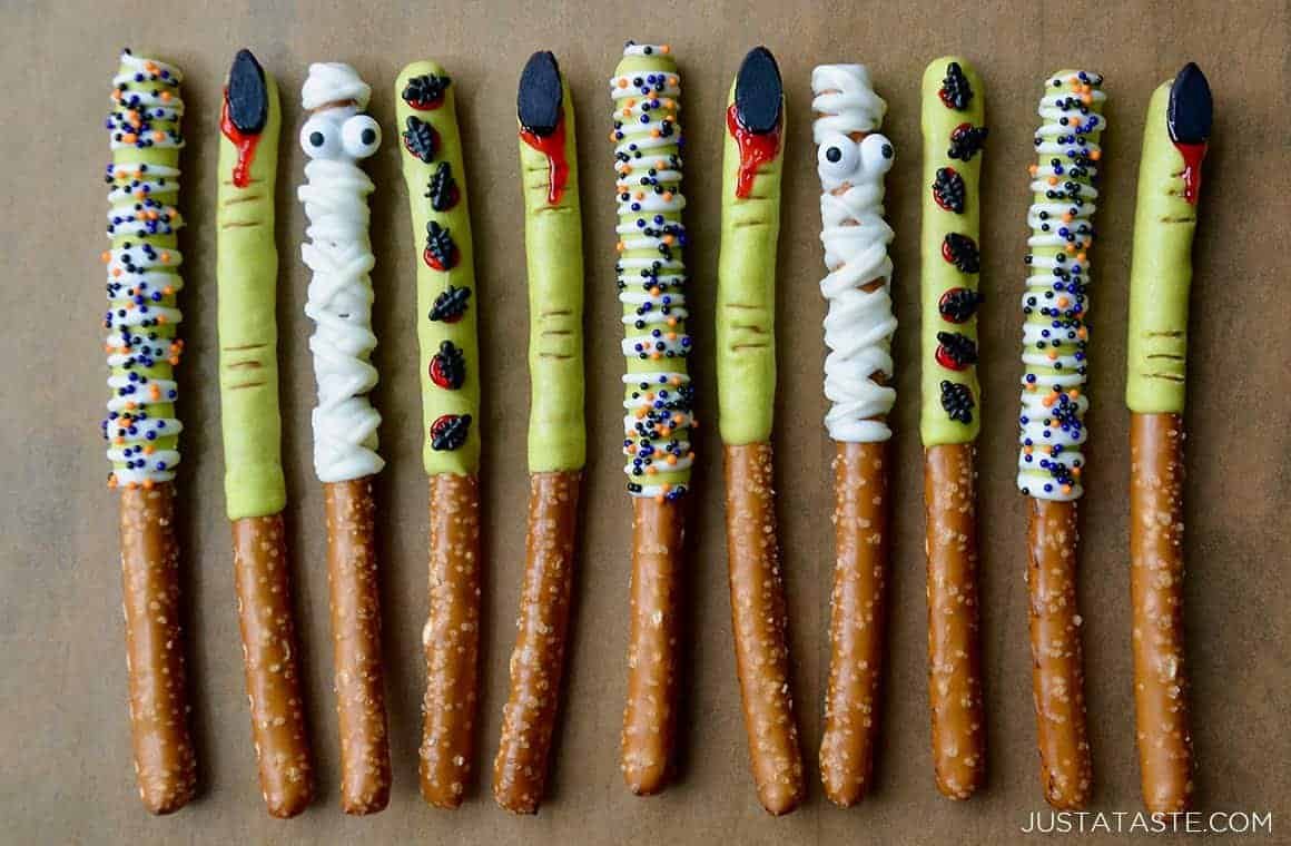 Chocolate dipped Halloween pretzel rods decorated as witch fingers and monsters