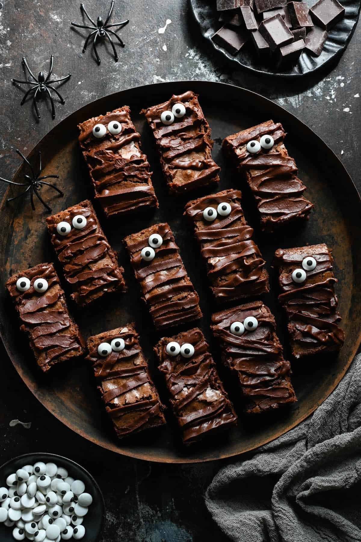 Mummy Halloween brownies wrapped in white chocolate bandages with candy eyes