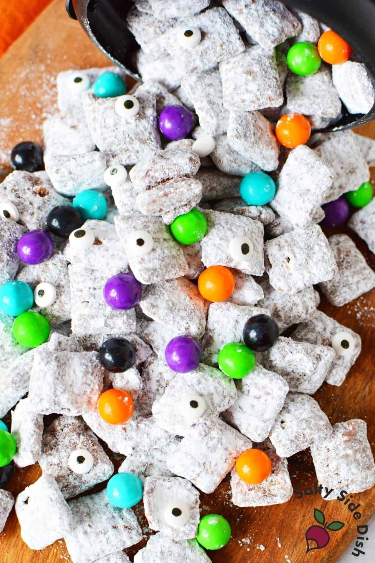 Halloween puppy chow snack mix with candy and candy eyes