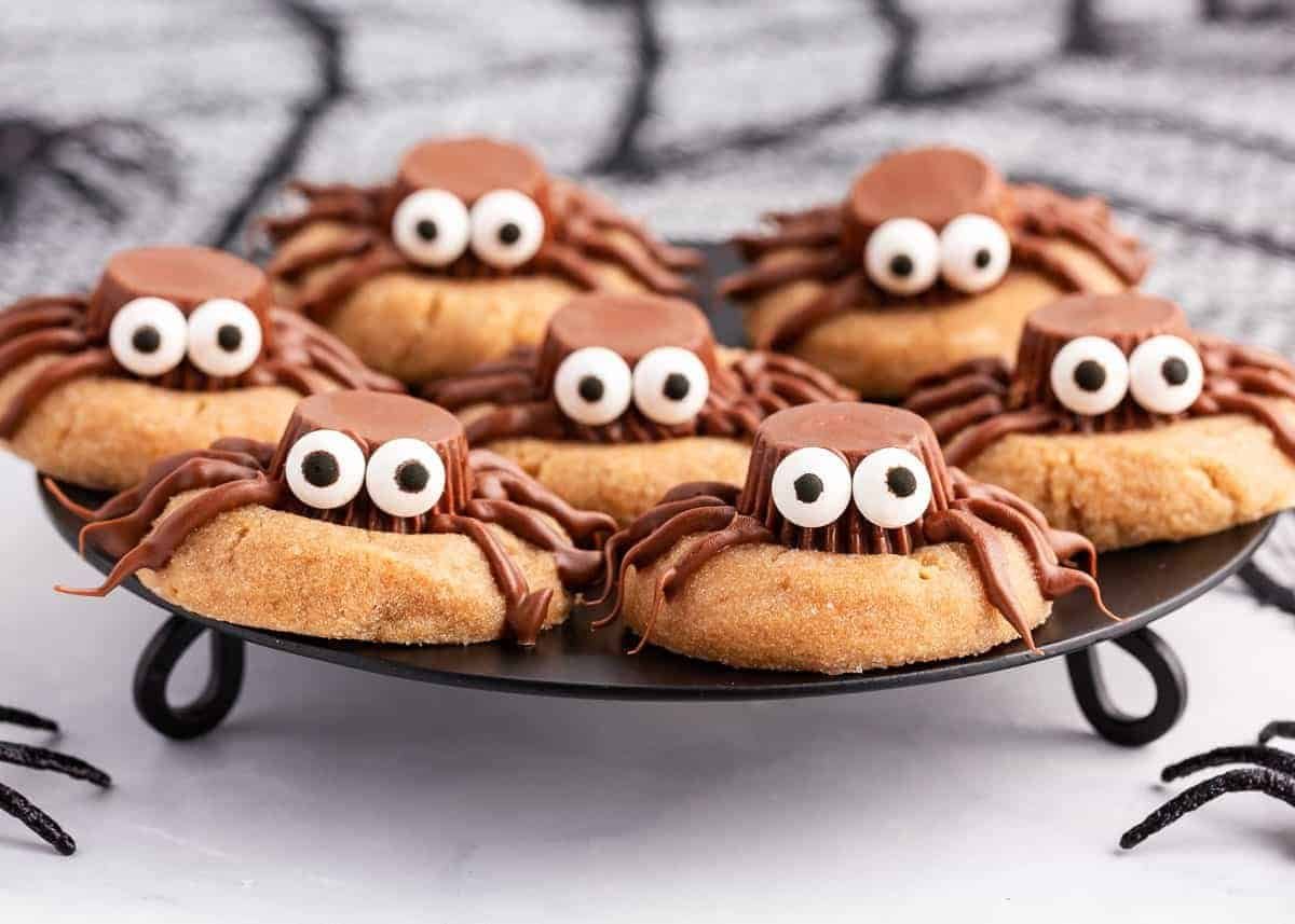 Peanut butter spider cookies with Reese's cups, chocolate legs and candy eyes