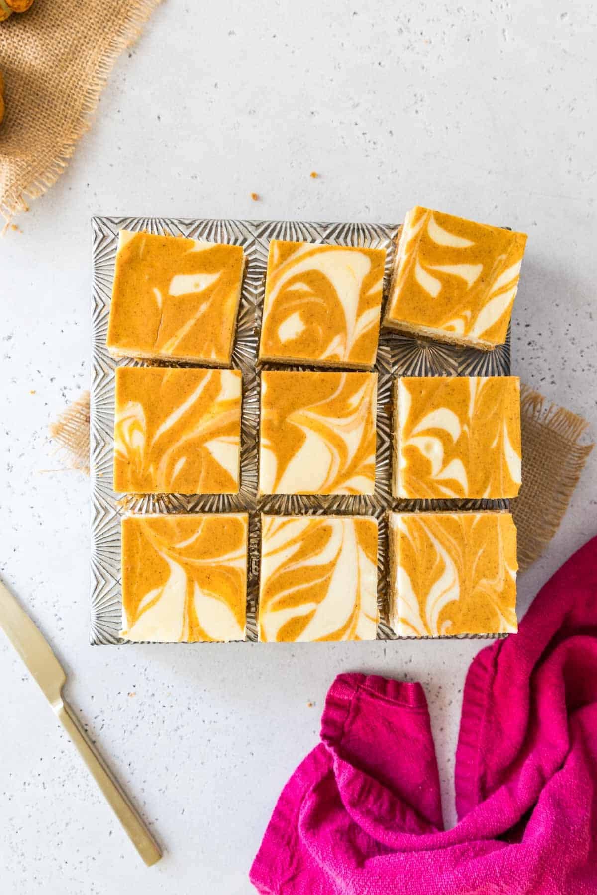 Swirled pumpkin cheesecake bars with graham cracker crust
