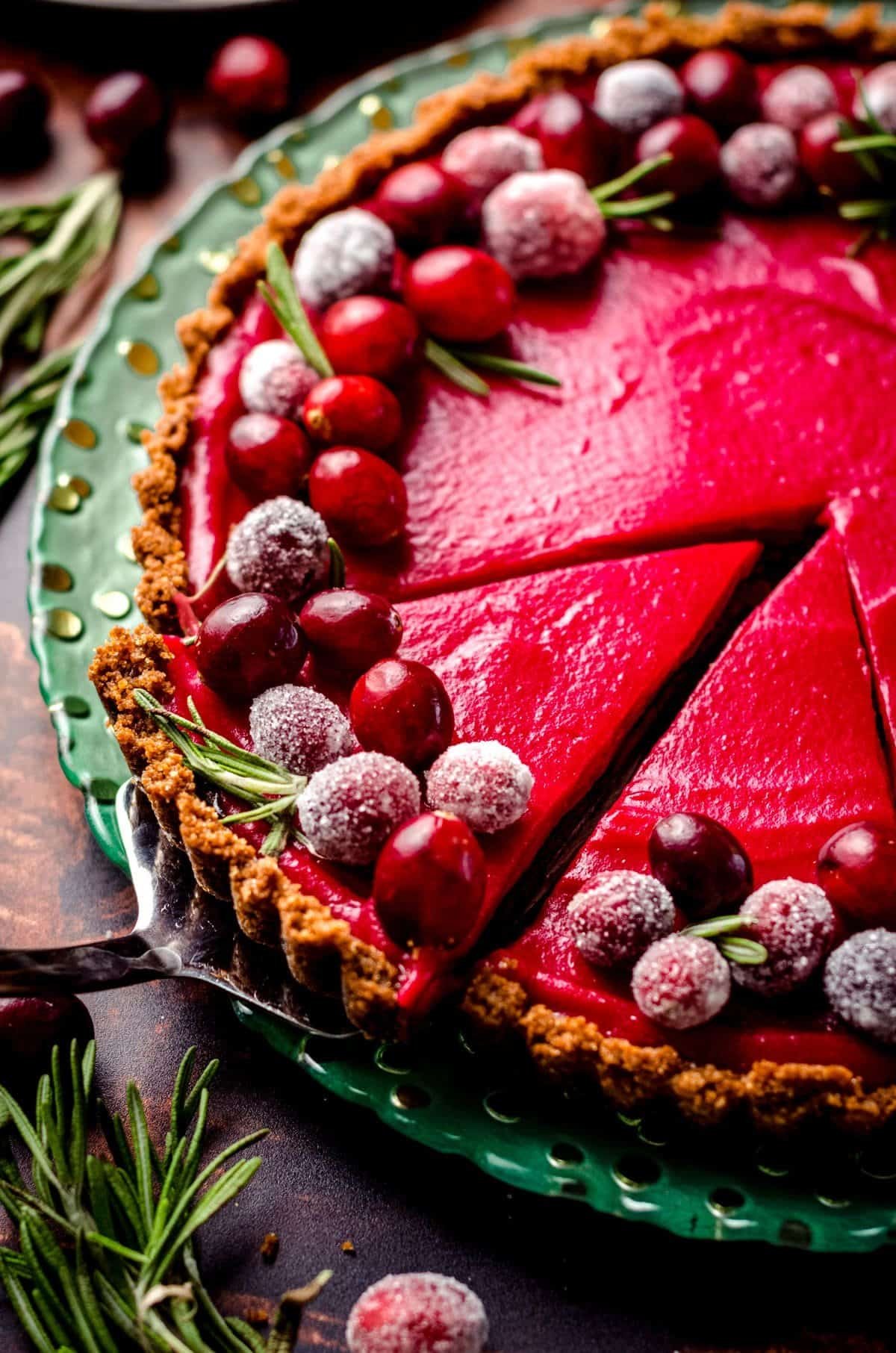 Cranberry curd tart with gingersnap crust and sugared cranberries