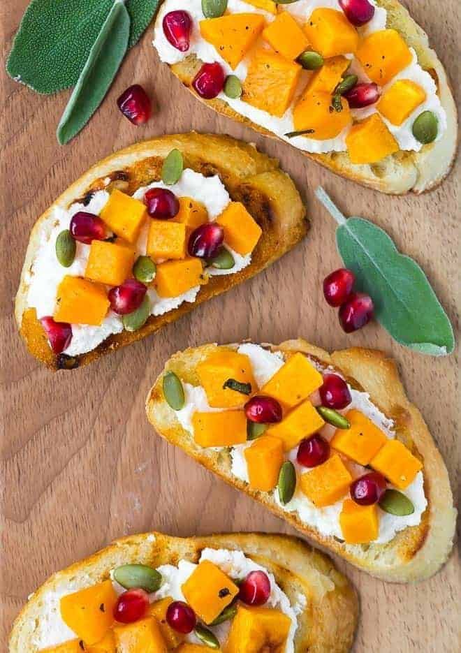 Butternut squash crostini with ricotta, pomegranate and pepitas