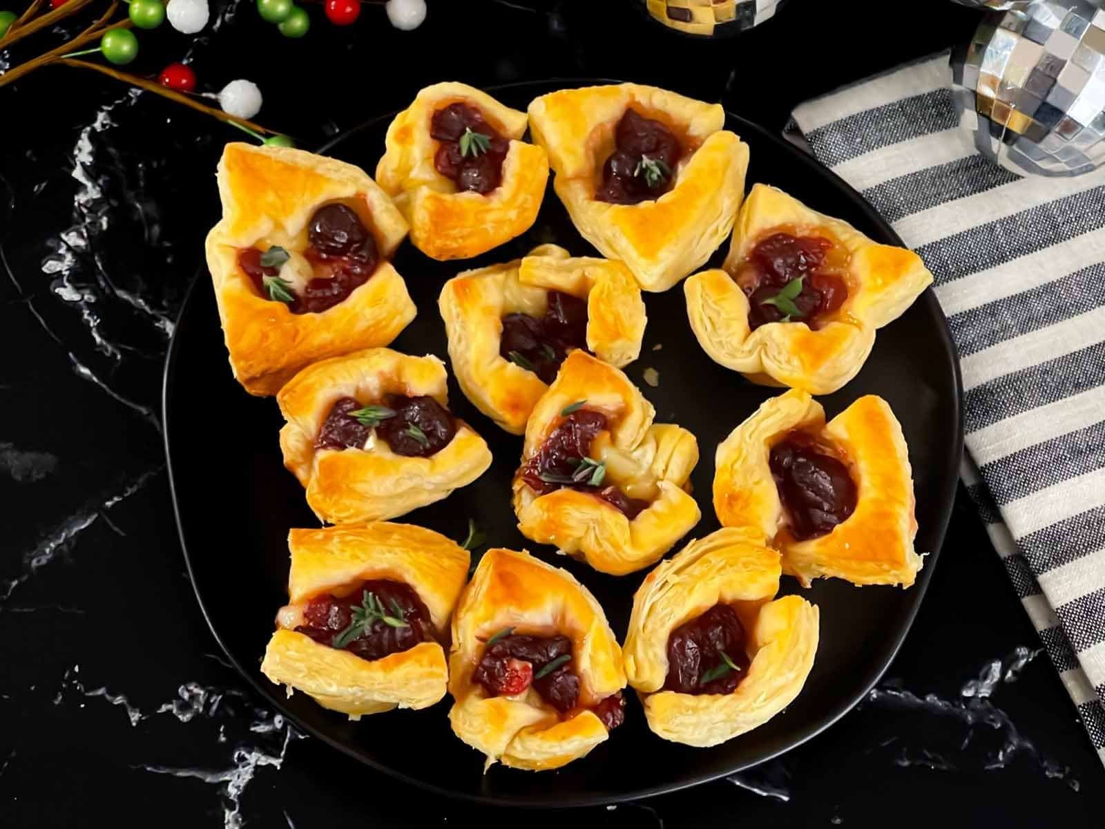 Puff pastry cranberry brie bites with fresh thyme