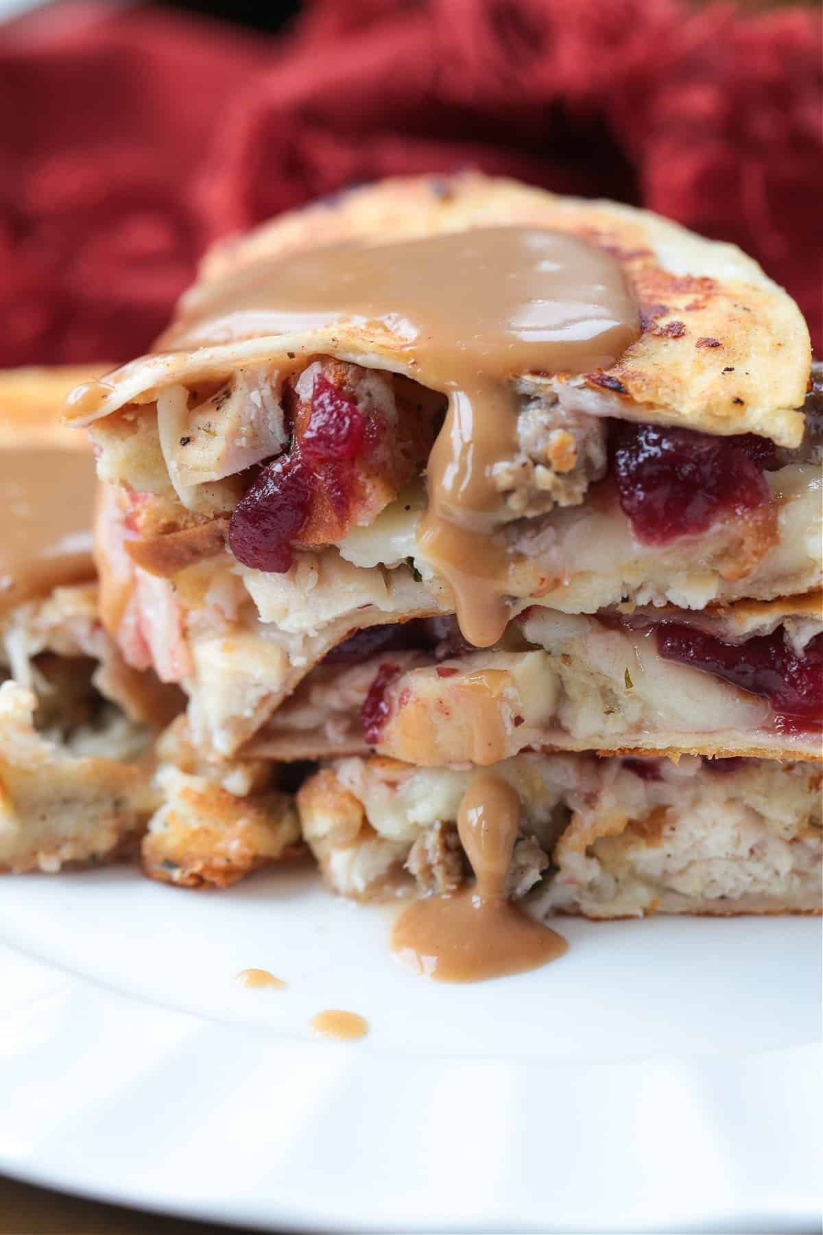 Stack of crispy Thanksgiving quesadillas filled with turkey, stuffing and cranberry
