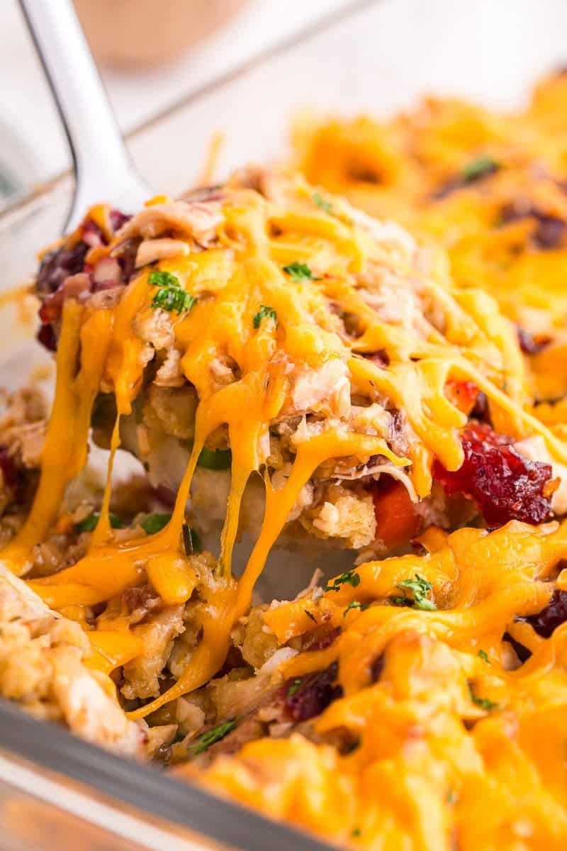 Layered leftover turkey casserole with mashed potatoes, stuffing, gravy and cheese